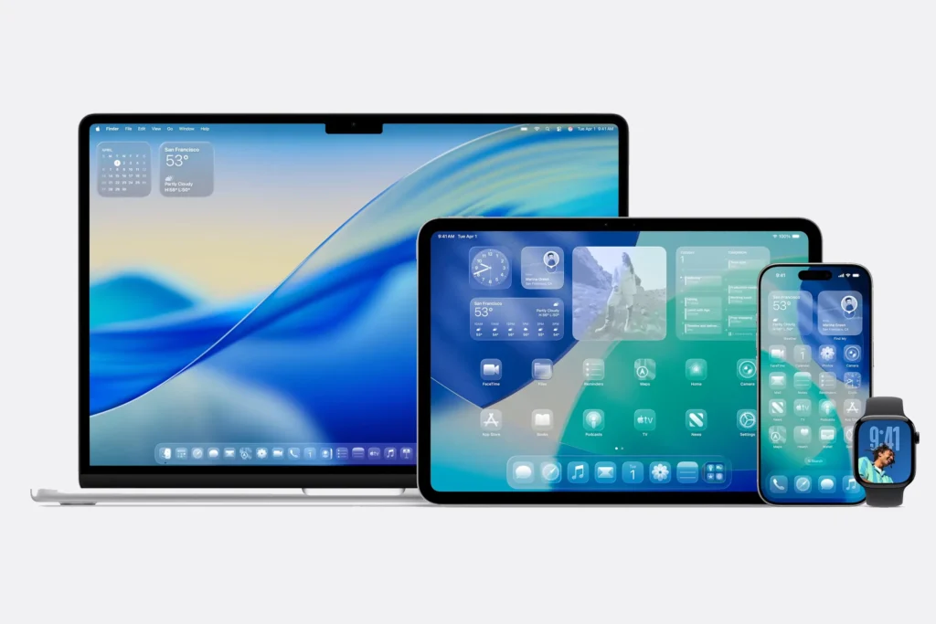 A MacBook, iPad, iPhone, and Apple Watch side-by-side, each displaying Apple’s new “Liquid Glass” interface with translucent widgets and rippling blue-green gradients.