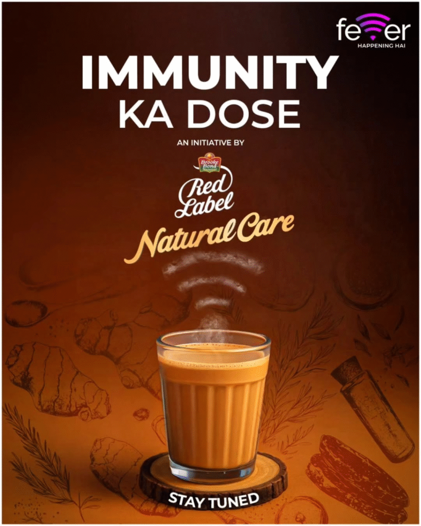 A steaming glass of chai emits aromatic swirls, set against a brown background with illustrated ginger, herbs, and spices, promoting immunity and wellness.