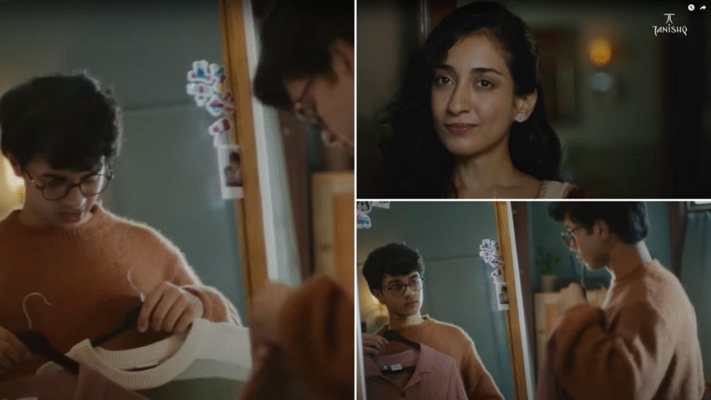 A young man stands in a cosy bedroom, holding up clothes on hangers and considering his reflection in a mirror decorated with photo stickers, highlighting a casual, everyday family moment from Tanishq’s Raksha Bandhan campaign.