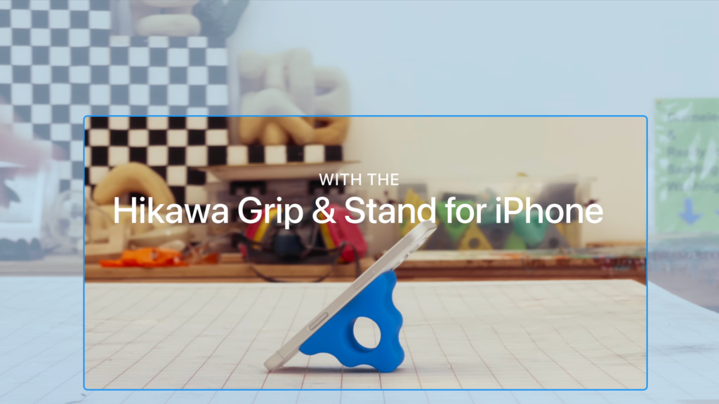 Title screen from Apple’s Hikawa Grip & Stand film, showing Apple accessibility branding focused on iPhone